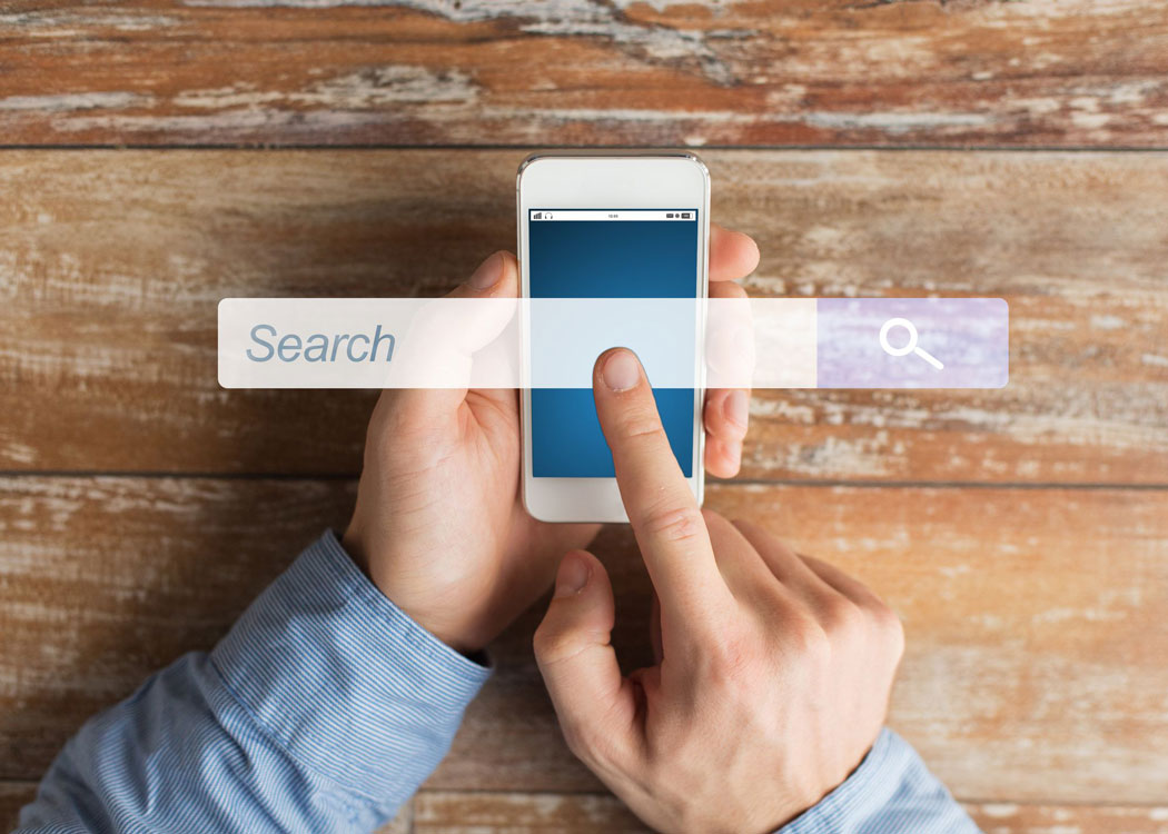 close up of male hands with smartphone on table